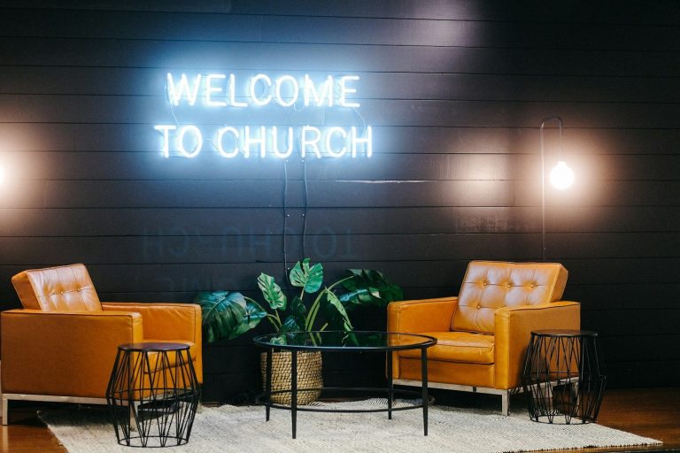 Stock Photo of a seating area with a sign that says welcome to church